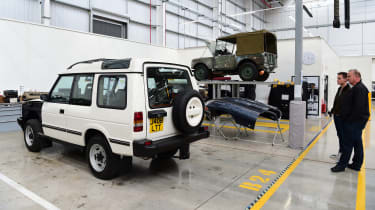 Auto Express editor-in-chief Steve Fowler looking at a first-generation Land Rover Discovery in a workshop