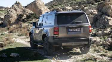 New Toyota Land Cruiser 48V Mild-Hybrid in Bronze, rear tracking 