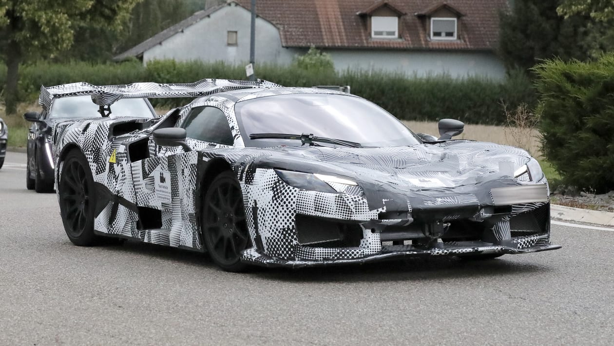 Ferrari’s next hypercar spied testing with hybrid power and big aero ...