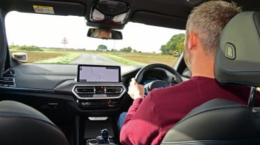 BMW iX3 - over-shoulder driving