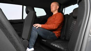 Volkswagen Tayron - third row of seats being sat in by Auto Express chief reviewer Alex Ingram 