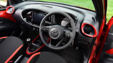 Toyota Aygo X vs Hyundai i10 vs Fiat 500 group test - Toyota Aygo X interior from driver&#039;s door