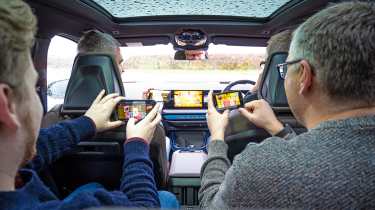 Auto Express team members playing Uno in a car (interior)