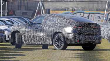 BMW iX4 - rear angled