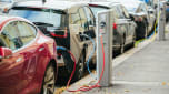 Electric cars charging on the street