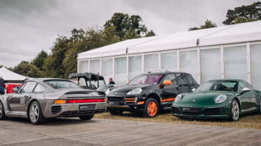 Porsche 959, Porsche Cayenne S Transsyberia, and Porsche 911 Millionth parked together