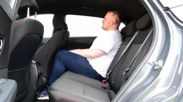 Auto Express news reporter Ellis Hyde sitting in the Hyundai Kona N Line&#039;s back seat