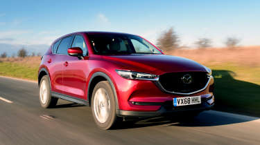 Three-car garage - Mazda CX-5 front tracking 