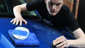 Cleaning product test on car bonnet