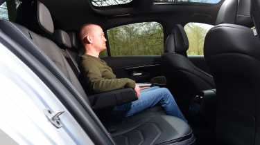 Auto Express chief reviewer Alex Ingram sitting in the back of the Mercedes E-Class
