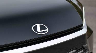 Lexus LM - Lexus badge detail, front