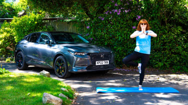 Auto Express pictures editor Dawn Grant striking a Yoga pose next to the DS4 E-Tense