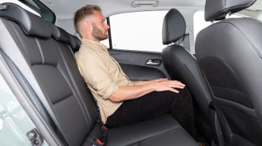 Charlie Harvey sitting in the rear seats of the Kia Picanto