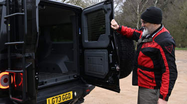 Auto Express senior test editor Dean Gibson inspecting the Ineos Grenadier&#039;s boot