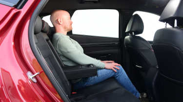 Auto Express chief reviewer Alex Ingram sitting in the Hyundai Tucson&#039;s back seat