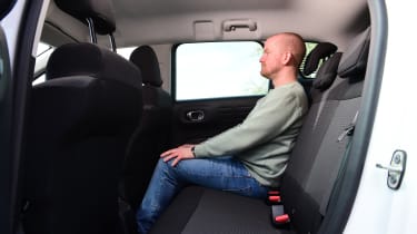 Auto Express chief reviewer Alex Ingram sitting in the Citroen C3 Aircross You!&#039;s back seat