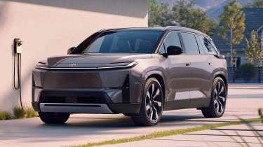 Toyota Highlander BEV - front 3/4 charging