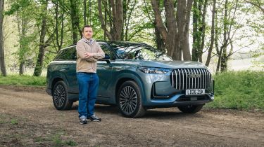 Auto Express senior content editor Shane Wilkinson standing next to the Jaecoo 8