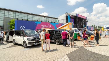 Festival attendees and campervans at VW Bus Fest 2023