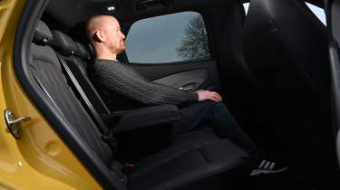 Auto Express chief reviewer Alex Ingram sitting in the Ford Capri&#039;s back seat