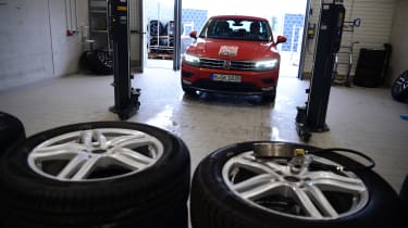 Volkswagen Tiguan driving into tyre workshop
