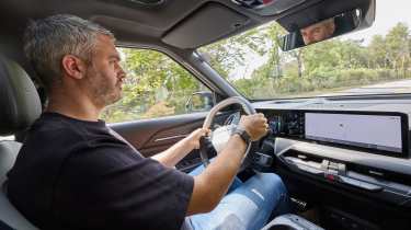Richard Ingram driving the Kia EV5