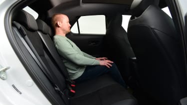 Auto Express chief reviewer Alex Ingram sitting in the Toyota C-HR&#039;S back seat