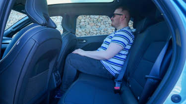 Auto Express news reporter Ellis Hyde sitting in the Renault Symbioz&#039;s rear seat