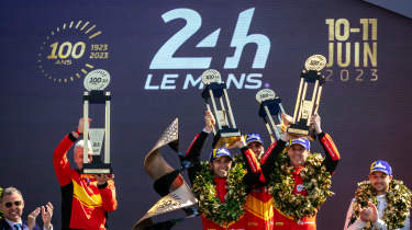 Le Mans drivers celebrating on the podium