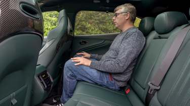 Paul Barker sitting in the Aston Martin DBX707