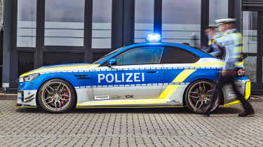 Police BMW M2 by AC Schnitzer - static side profile with police officer