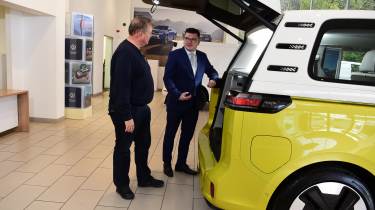 Auto Express editor-in-chief Steve Fowler being shown the Volkswagen ID. Buzz&#039;s boot by Volkswagen sales executive Tom Lodge 