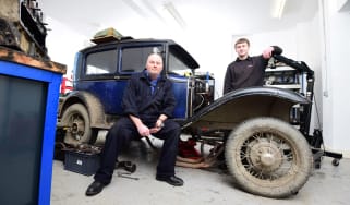 Teacher and student with classic car