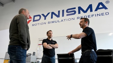 Dynisma staff discussing simulator with Steve Sutcliffe