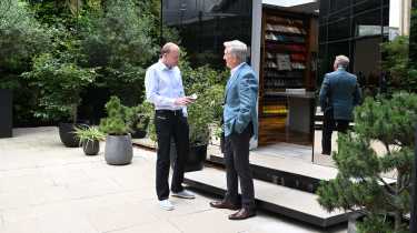 Aston CEO Adrian Hallmark talking to Phil McNamara outside