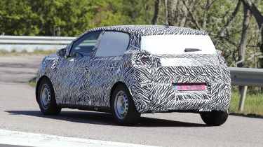 Dacia electric city car (camouflaged) - rear 3/4