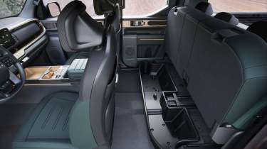 Kia Tasman - rear seat storage