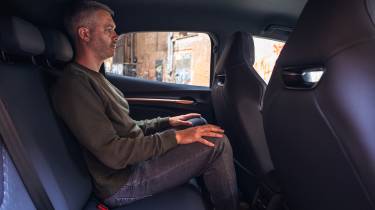 Auto Express deputy editor Richard Ingram sitting in the Cupra Raval's rear seat