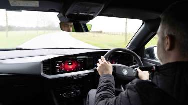 Vauxhall Mokka Electric - interior driving shot with Auto Express Deputy Editor, Richard Ingram