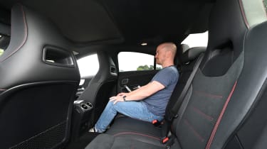 Auto Express chief reviewer Alex Ingram sitting in the Mercedes CLA&#039;s back seat