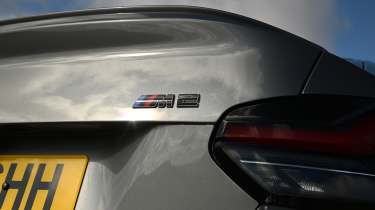 New BMW M2 being driven in the UK - rear tail light and M2 badge 