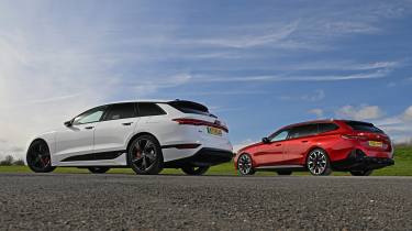 Audi S6 Avant e-tron and BMW i5 Touring M60 - rear static 