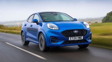 Facelifted Ford Puma being driven in the UK - front tracking 