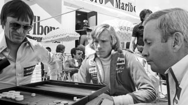 Bernie Ecclestone plays backgammon in the paddock with James Hunt in 1977