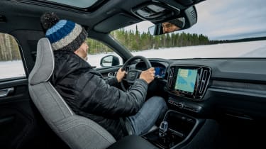 Auto Express deputy editor Richard Ingram driving a Volvo EX40 prototype