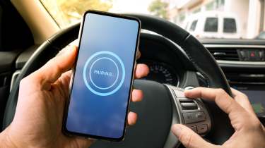 Smartphone being paired to a car