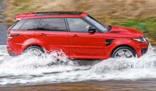 Range Rover driving through ford