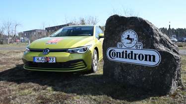 VW Golf parked next to &#039;Contidrom&#039; sign