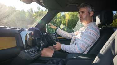Auto Express deputy editor Richard Ingram driving the Land Rover Defender Trophy Edition