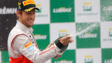 Jenson Button celebrates his victory in the Brazilian Grand Prix